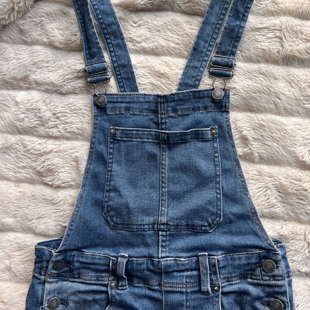 Free People denim overalls.